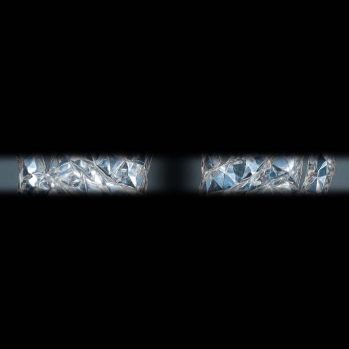 Crystalline diamonds visible through a narrow horizontal opening in black